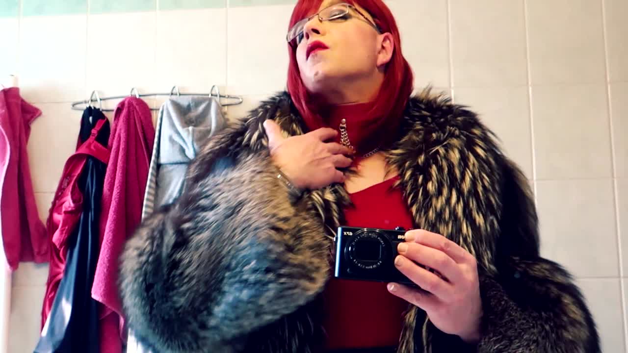 Red vixen teasing in the mirror